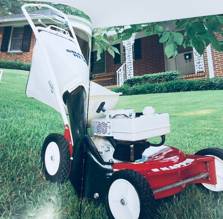Inside view of the 1990 Snapper Lawn Mowers Dealer Showroom Sales Guide Catalog featuring a red Snapper lawn mower on a green lawn.