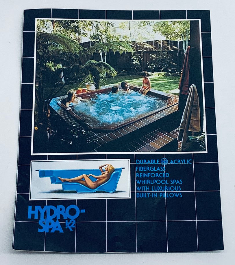 1982 Hydro Spa K2 Durable Acrylic Fiberglass Reinforced Whirlpool Spas Catalog featuring a cozy outdoor setting with hot tub and people enjoying the spa.