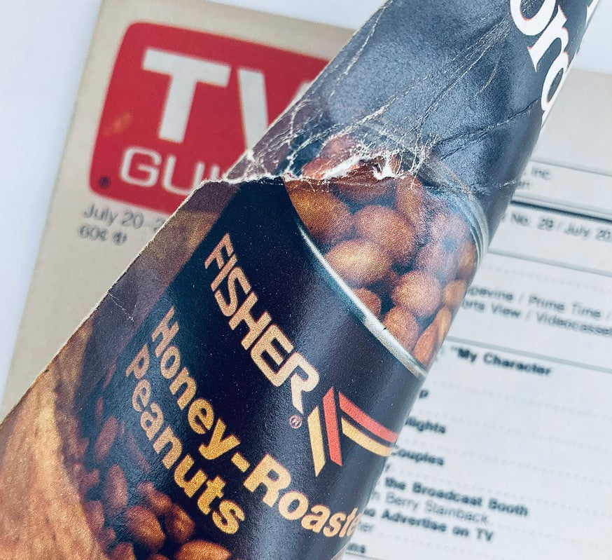 Close-up of a Fisher Honey-Roasted Peanuts advertisement in the TV Guide Magazine from July 20, 1985, highlighting vintage food marketing.