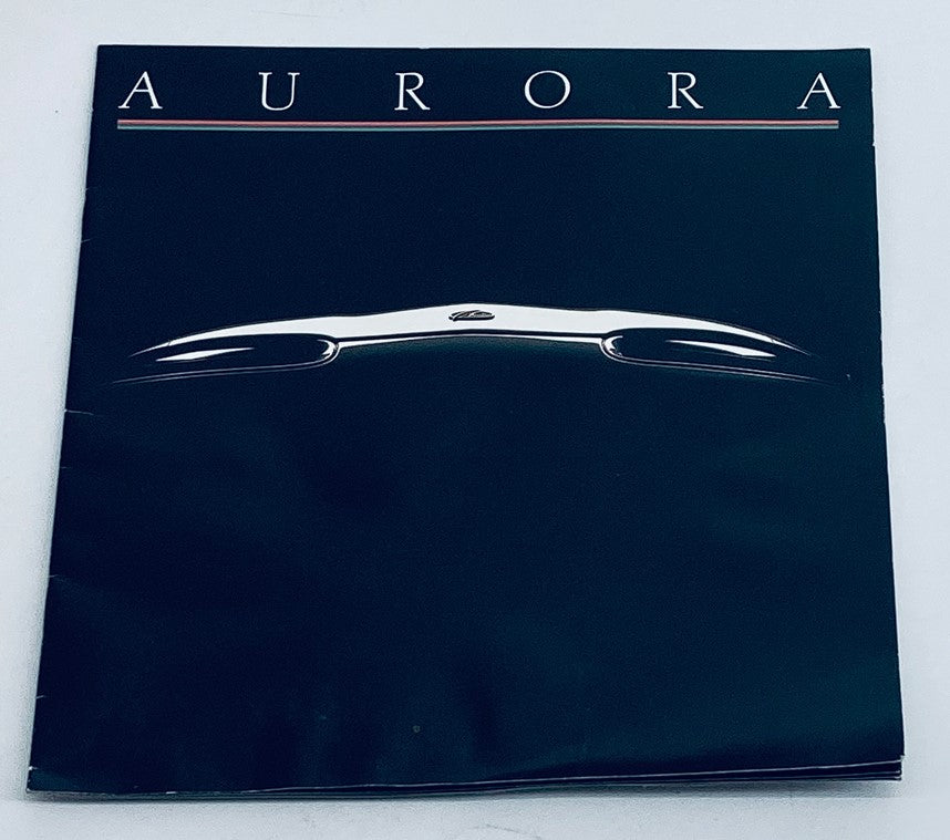 Front cover of the 1995 Oldsmobile Aurora Lineup Dealer Showroom Sales Brochure Catalog showcasing the Aurora logo.