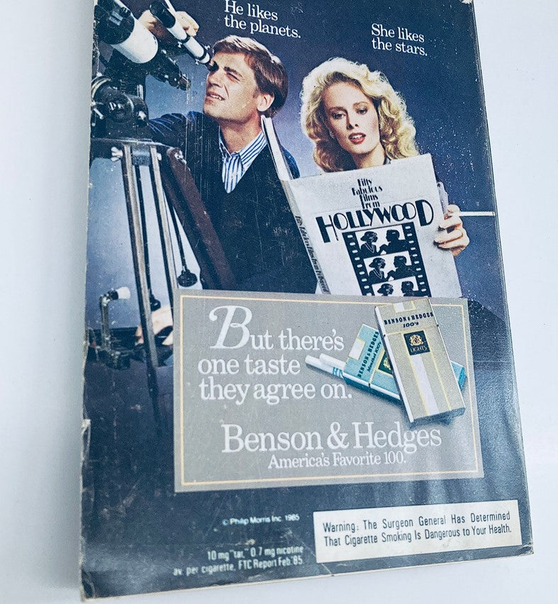 Back cover of TV Guide Magazine September 21, 1985 with a vintage advertisement for Benson & Hedges cigarettes, featuring a couple looking through telescopes.