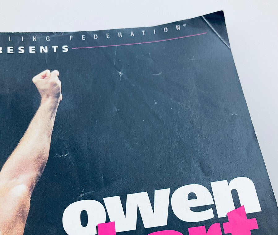 Close-up of the WWF World Wrestling Federation Magazine Owen Hart Tribute 1965-1999 cover, highlighting the title and design details, emphasizing the tribute to Owen Hart.