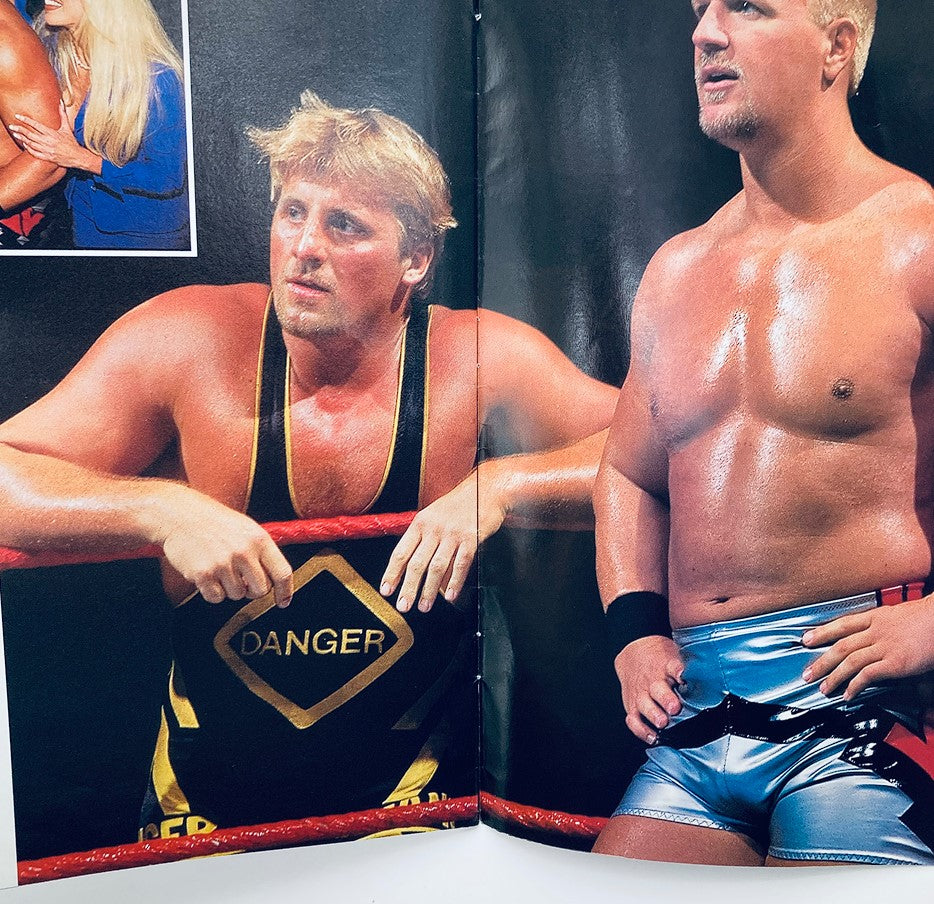 WWF World Wrestling Federation Magazine Owen Hart Tribute 1965-1999 - Features Owen Hart leaning on the ropes, showcasing his expression along with another wrestler, a moment from the wrestling community.