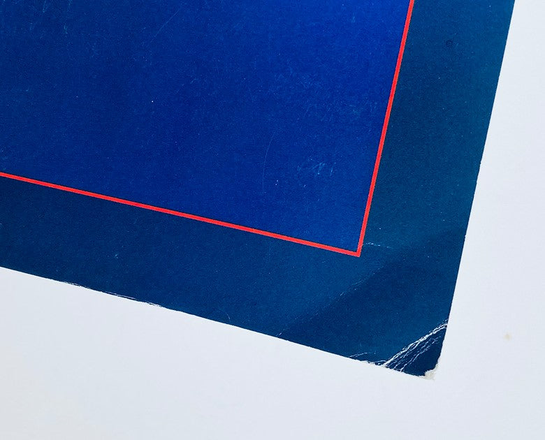 Close-up of the 1986 Dodge Ram 50 Dealer Showroom Sales Brochure showing a corner with a blue and red design detail.