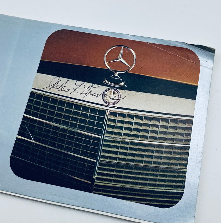 Detailed view of the grille from the 1972 Mercedes-Benz 450 SE Lineup Dealer Showroom Sales Brochure, highlighting the distinctive logo and design.
