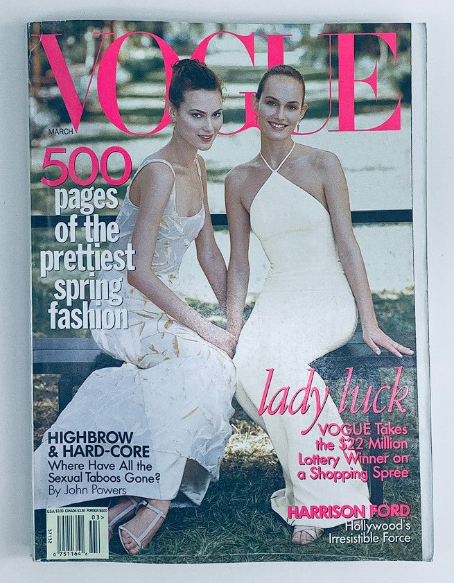 Vogue Magazine March 1997 cover featuring models Amber Valletta and Shalom Harlow, showcasing spring fashion, highlighted in vibrant colors and artistic photography.