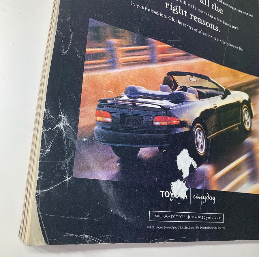 Back cover of the InStyle Magazine June 1998 featuring a stylish Toyota Celica convertible in motion, along with advertising text for Toyota cars, highlighting their appeal.