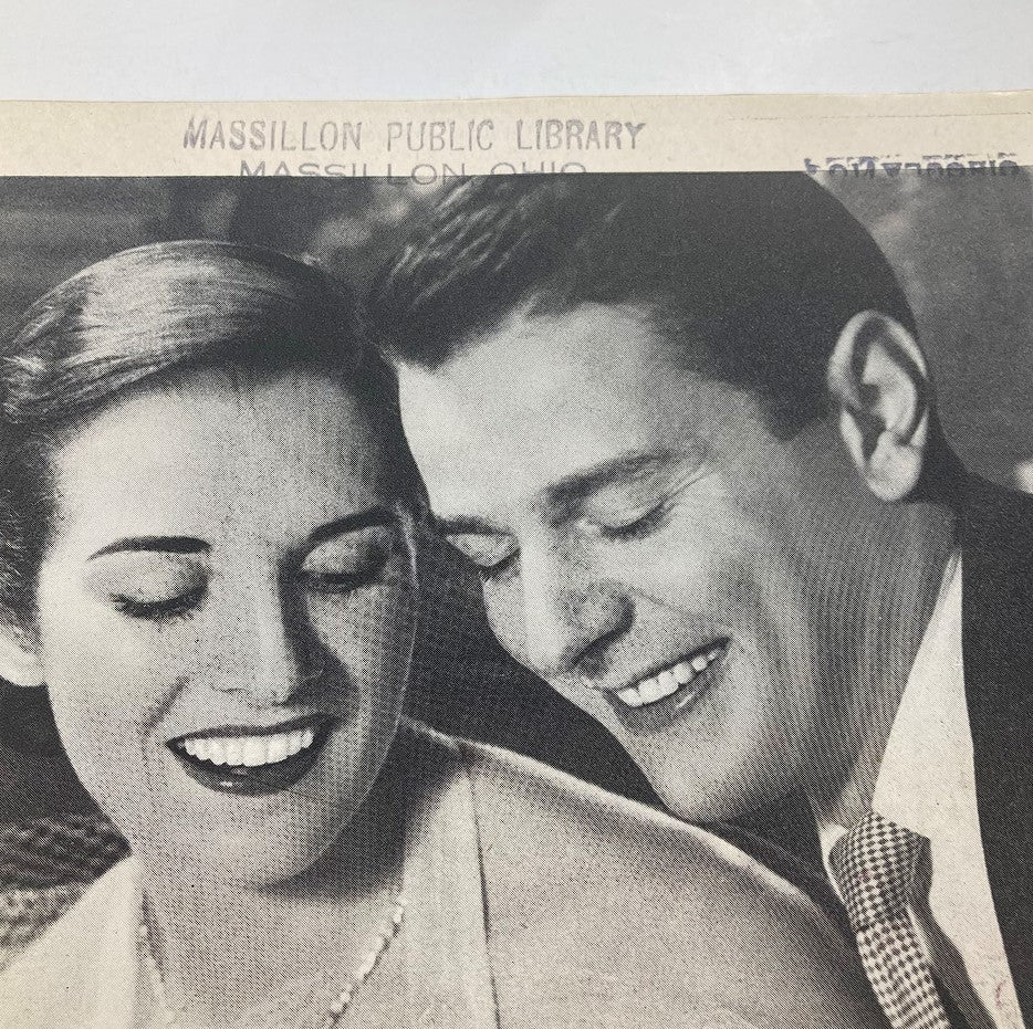 The Saturday Evening Post March 3 1951 cover image featuring a happy couple smiling, symbolizing the nostalgic charm of mid-20th century American culture.