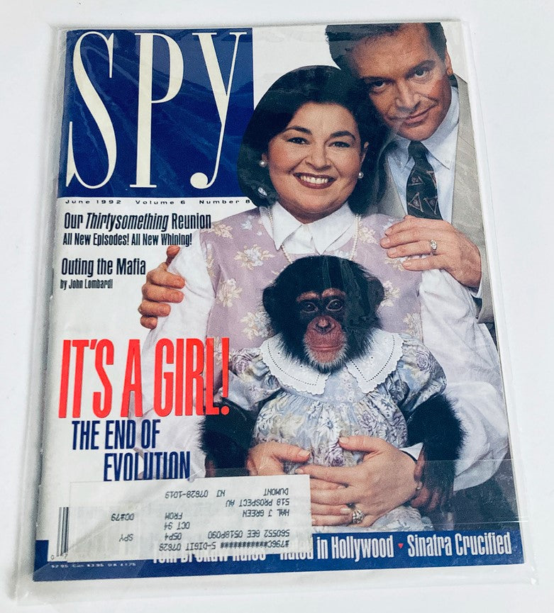 Cover image of Spy Magazine June 1992 showcasing Roseanne Barr, Tom Arnold, and a chimpanzee, with the title 'It's a Girl! The End of Evolution'.