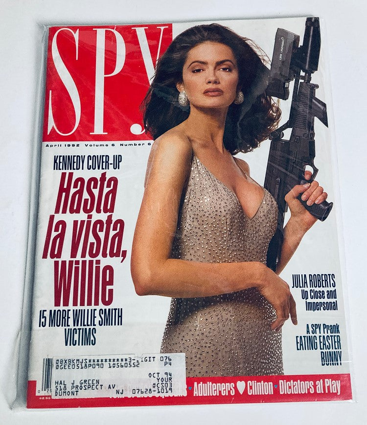 Another view of the cover of Spy Magazine, April 1992, displaying Michelle Turley in a shimmering gown with a provocative pose, reflecting the magazine's bold style and social commentary.