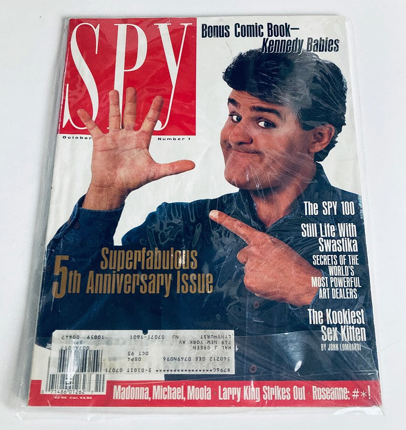 Spy Magazine October 1991 cover in protective wrapping emphasizing its collector's item status.