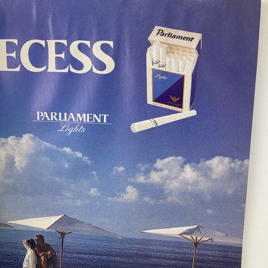 Vintage advertisement for Parliament Lights cigarettes featured in Spy Magazine November 1989, depicting a beach scene.