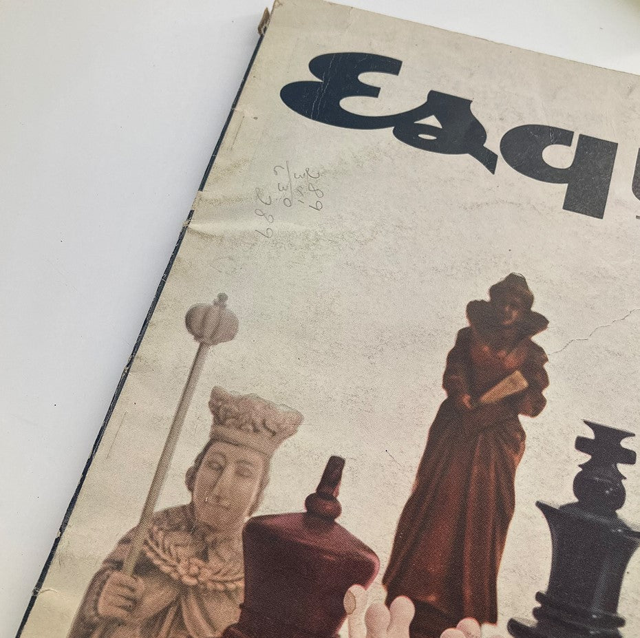 Close-up of the cover of VTG Esquire Magazine February 1957, highlighting the title and vintage chess piece details.