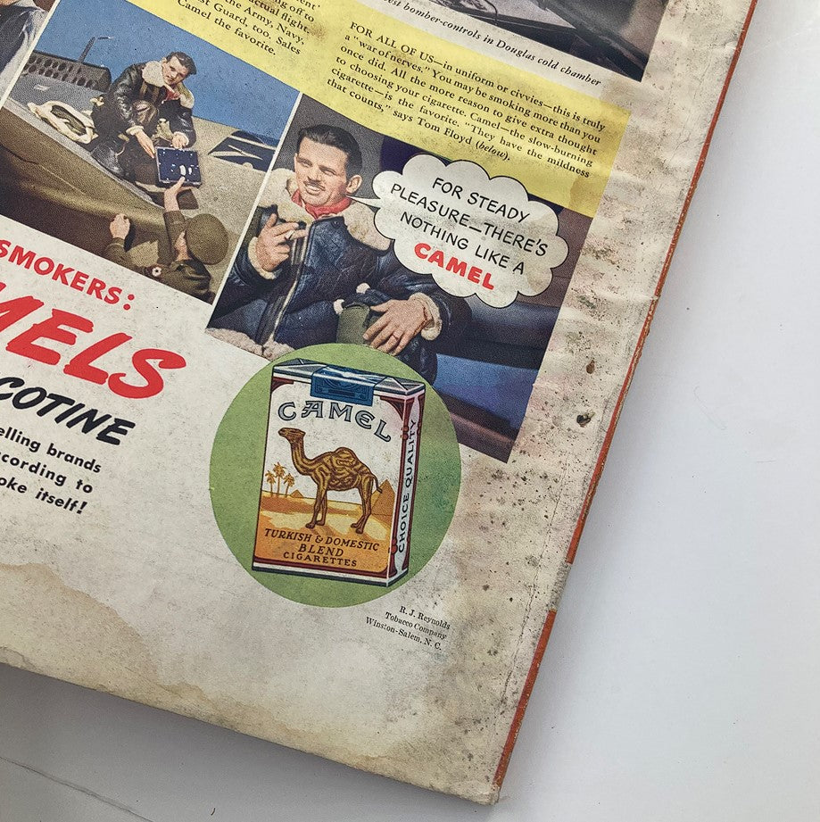 Close-up view of the Camel cigarette advertisement in VTG Esquire Magazine Victory Issue August 1942, featuring a smoking pilot and product visuals.