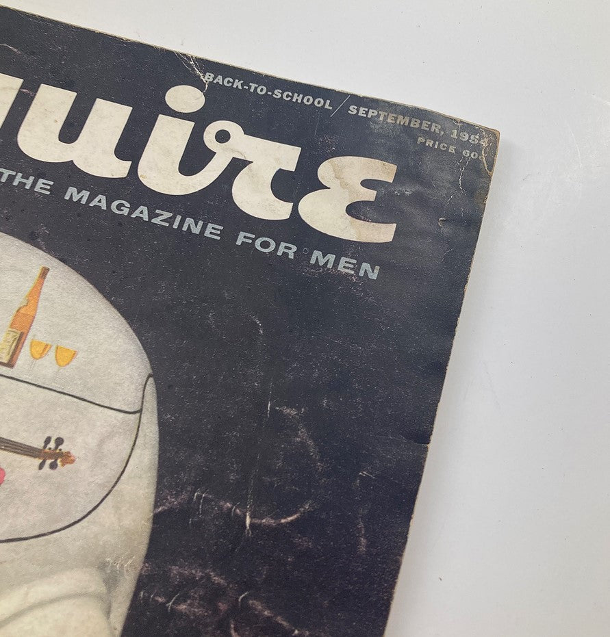 Close-up of the cover of VTG Esquire Magazine September 1954, showcasing the title 'Esquire: The Magazine for Men' along with an artistic illustration and the date.