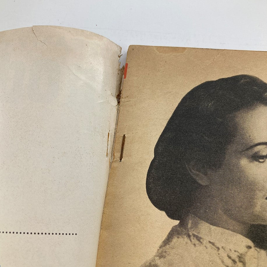 Close-up of the vintage Modern Screen Magazine September 1957, featuring signs of wear on the cover and pages, emphasizing its collectible nature in classic cinema.