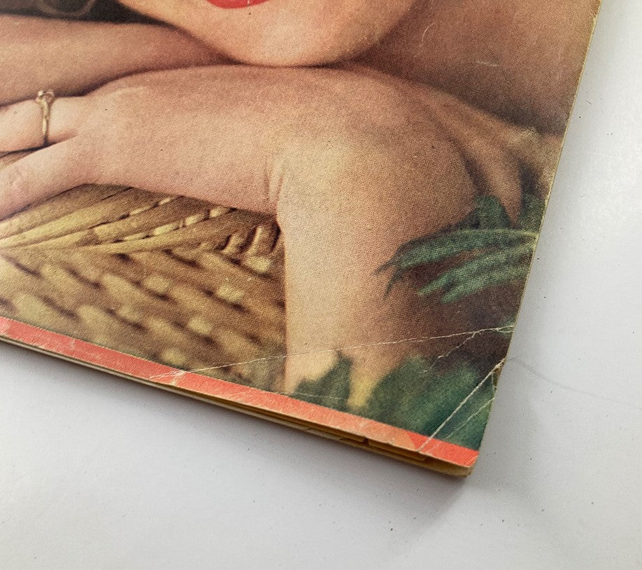 Close-up of the VTG Modern Romances Magazine November 1957 cover detail featuring a woman's hand and a woven basket, showcasing vintage magazine aesthetics.
