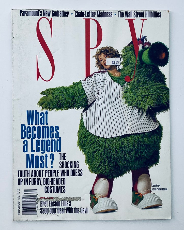 Spy Magazine December 1990 cover featuring Joan Rivers humorously dressed as the Phillie Phanatic, highlighting pop culture and comedy.