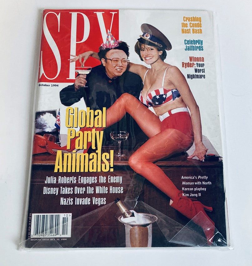 Wrapped cover of Spy Magazine October 1994, highlighting Julia Roberts and Kim Jong Il in a playful, satirical pose, the perfect collector's item for fans of pop culture.