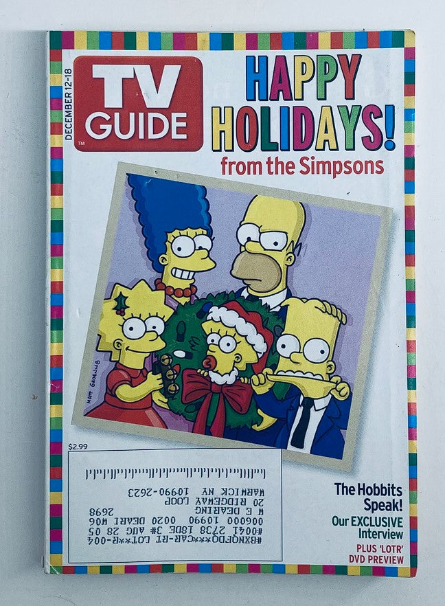 Cover of TV Guide Magazine December 12, 2004 featuring a family portrait of The Simpsons characters celebrating the holidays, part of the New York Metro edition.