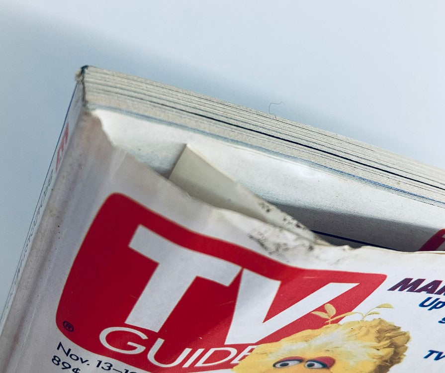 Close-up view of the TV Guide Magazine from November 13, 1993 featuring Hillary Clinton and Mariah Carey on the cover, showcasing the magazine's vintage red and white logo and textured pages.