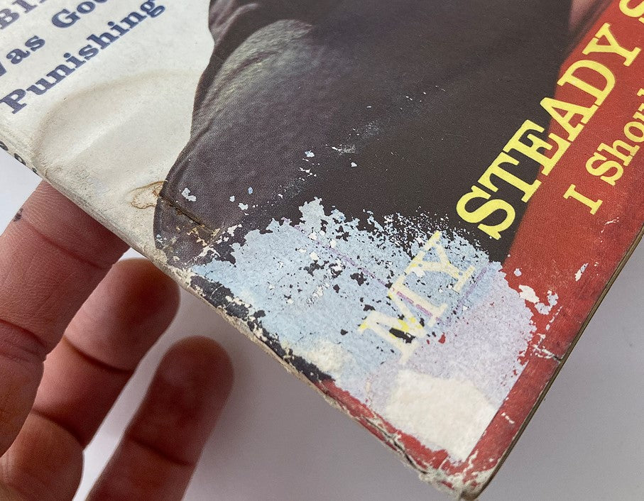 Detailed view of the wear on the cover of VTG Secrets Magazine March 1960, highlighting the title 'My Steady Sought Revenge' with signs of age and use.