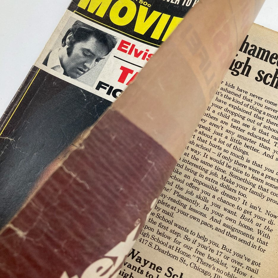 Inside page of the Vintage Movie Mirror magazine from January 1974, showing an image of Elvis Presley with accompanying text, emphasizing the magazine's focus on celebrity news.