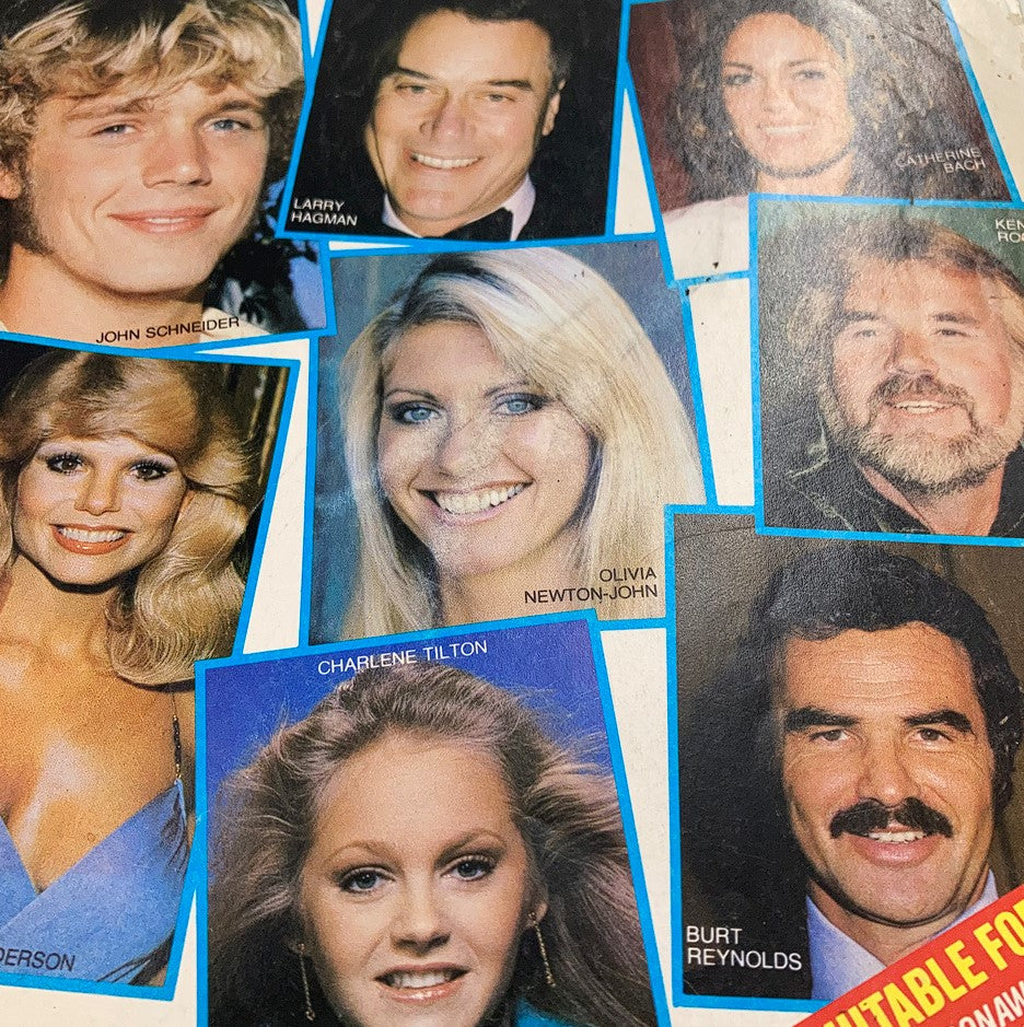 Close-up of the TV & Movie Screen December All Star Photo Album cover showcasing Olivia Newton-John along with Larry Hagman, John Schneider, and other celebrities, highlighting the vibrant entertainment landscape of the 1980s.
