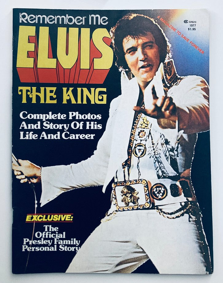 Cover of the 1977 Remember Me - Elvis Presley Complete Photos and Story of His Life & Career magazine, featuring a vibrant design with the title 'ELVIS THE KING' and a striking image of Elvis in a white jumpsuit.