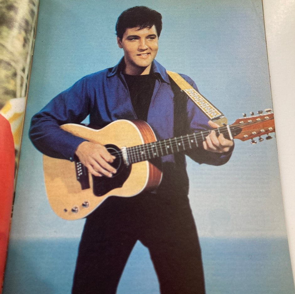 Image from VTG 1978 Elvis Presley The Legend Lives On magazine showing Elvis Presley performing with a guitar.