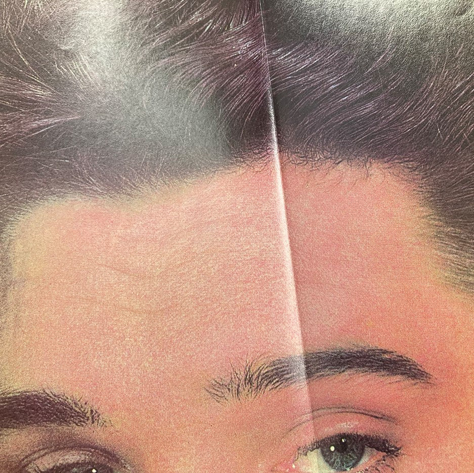 Close-up view of Elvis Presley from inside the VTG Rock Stars Magazine 1987, showcasing his iconic hairstyle and facial features.