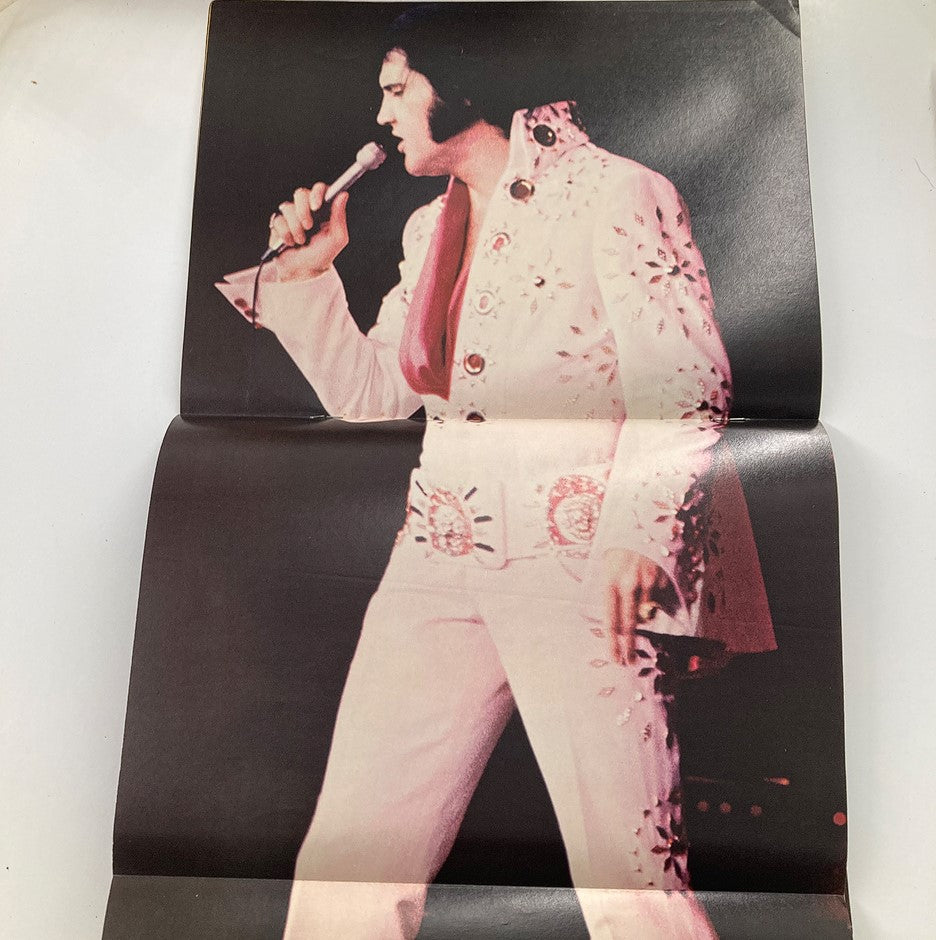 Giant foldout poster from the 1979 Elvis Presley Lives Memorial Edition magazine displaying Elvis in his iconic white jumpsuit while performing.