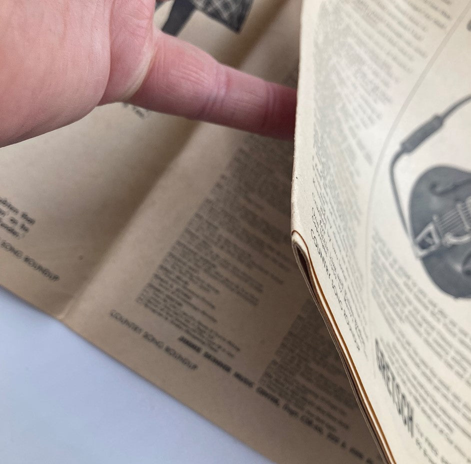 Close-up view of VTG Country Song Roundup Magazine May 1960 Vol 12 #66 showing the pages being turned, highlighting the vintage paper quality.