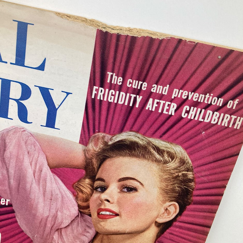 Close-up of the VTG Real Story Magazine May 1957 cover highlighting topics like frigidty after childbirth, featuring an elegant woman with styled hair.