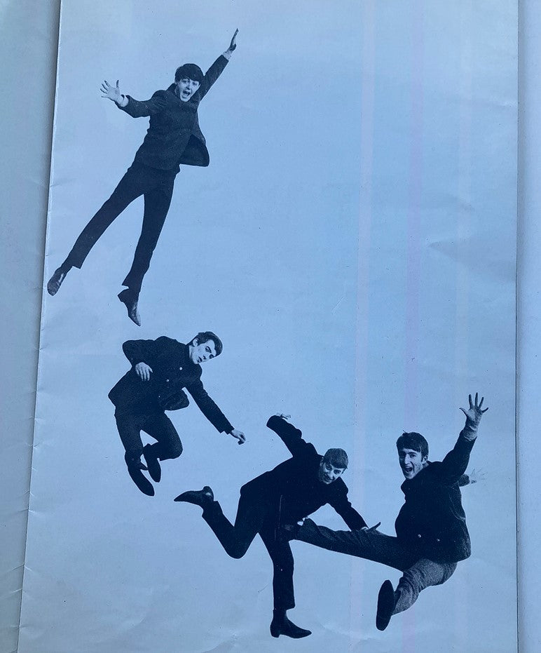 Page from 'The Compleat Beatles' displaying a photographic montage of The Beatles in dynamic poses, emphasizing their energetic performances.