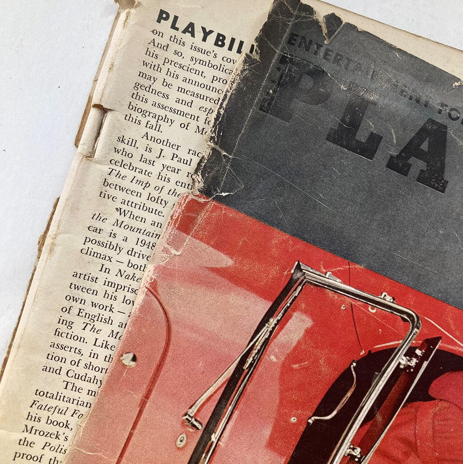 Close-up of the torn edge of Playboy Magazine August 1963, highlighting wear and tear typical of vintage publications.