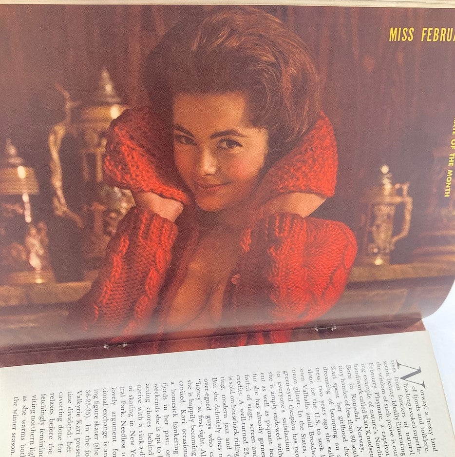 Inside page of the VTG Playboy Magazine February 1962, featuring the centerfold model in a cozy red sweater, highlighting the allure of vintage Playboy.