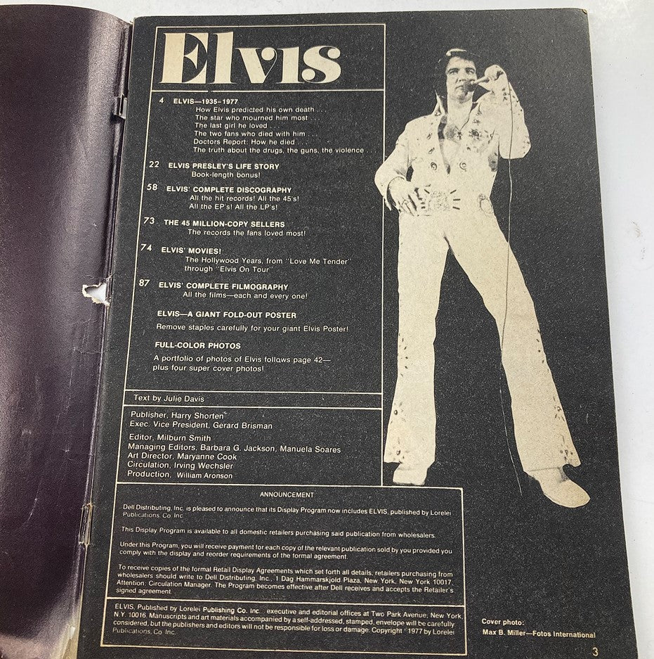 Inside page of the VTG 1977 Elvis Presley Memories Forever Collector's Edition, displaying a black and white image of Elvis Presley in a white jumpsuit with details about his career highlights and discography.