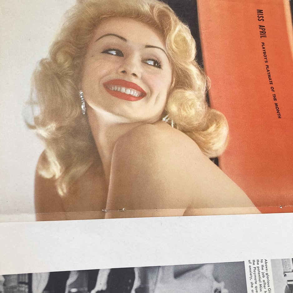 Playmate Rusty Fisher featured in Playboy Magazine April 1956, showcasing her glamorous appearance and captivating smile, representing the mid-century aesthetic.