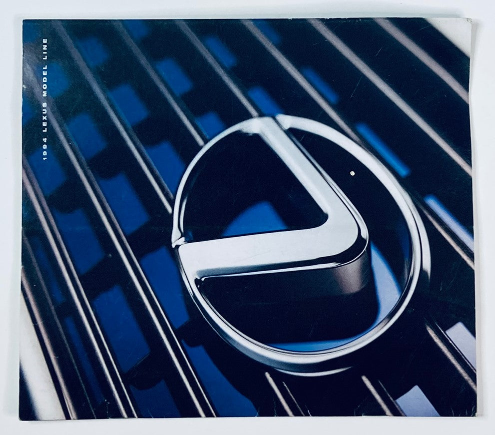 1994 Lexus Model Line dealer showroom sales brochure featuring the iconic Lexus logo against a sleek black grille background. Explore the details of Lexus' renowned models from 1994.