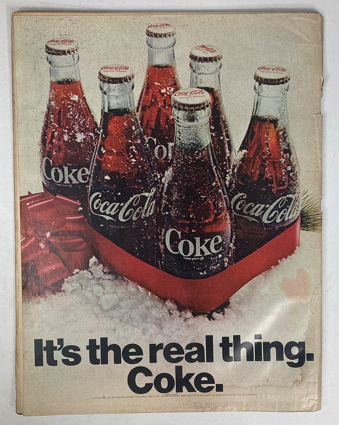Vintage advertisement for Coca-Cola featuring bottles in a festive setting, from the VTG Life Magazine December 26, 1969 issue.