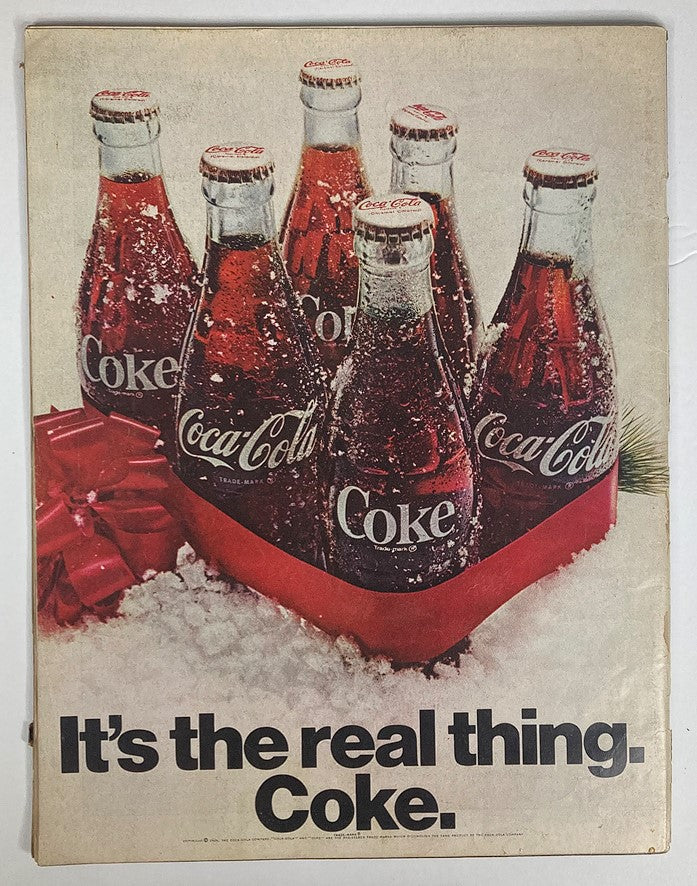 Ad page from the Vintage Life Magazine December 26, 1969 featuring a Coca-Cola advertisement with classic glass bottles in a festive setting.