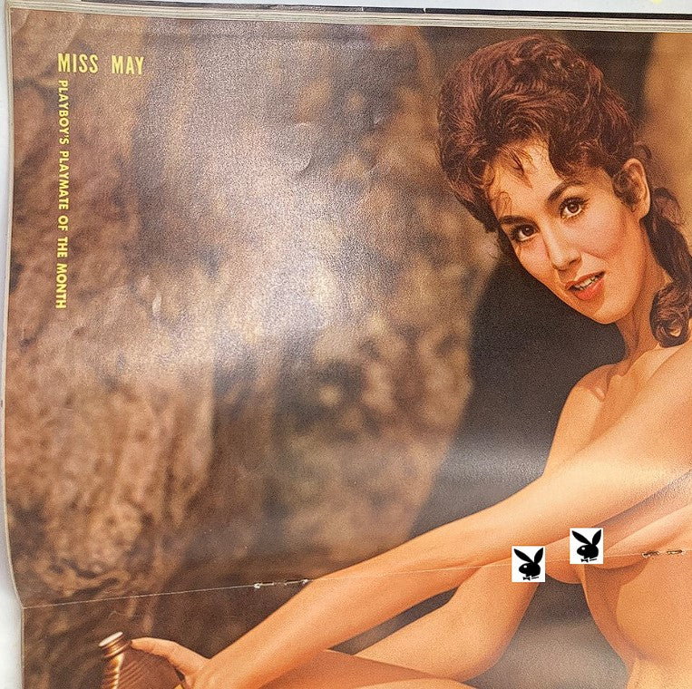 Centerfold from Playboy Magazine May 1962 featuring Marya Carter as Playmate of the Month, highlighting her captivating pose and vintage photography style.