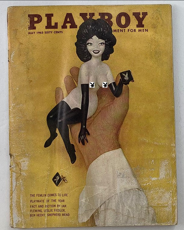 Playboy Magazine May 1963 featuring an illustrated cover with a prominent figure of a woman and playful elements, showcasing the iconic style of the era.