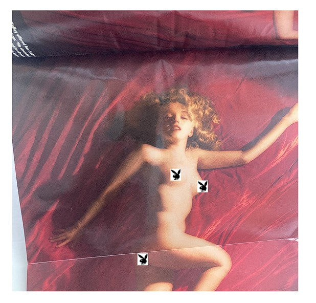 Centerfold from Playboy Magazine January 1997, featuring artistic photography with Marilyn Monroe, highlighting the publication's vintage appeal.