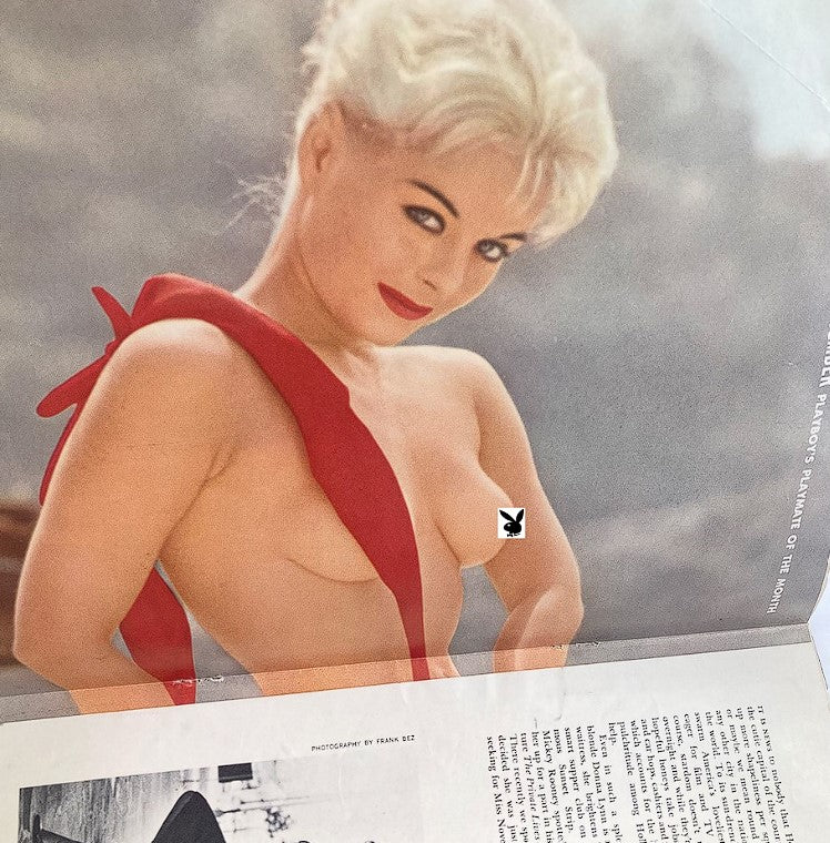 Vintage Playboy Magazine November 1959 centerfold featuring Donna Lynn, a glamorous model with platinum blonde hair, wearing a striking red accessory.