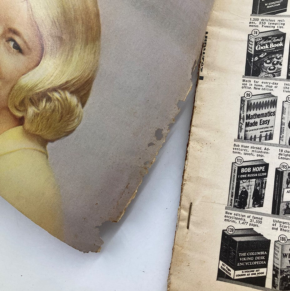Close-up of a featured image from VTG TV Radio Mirror Magazine February 1964, showcasing Donna Douglas with a vintage hairstyle and an edge of the magazine's pages.