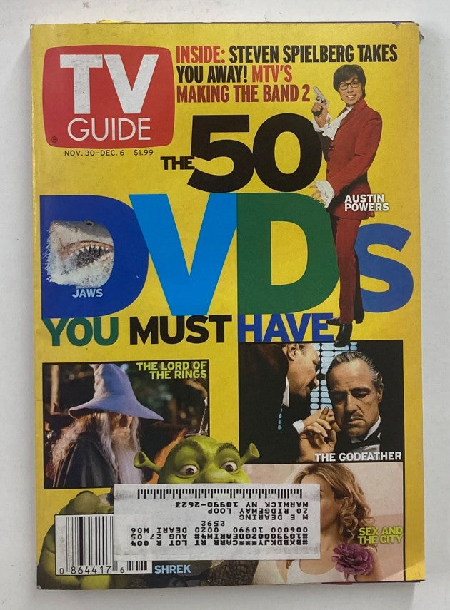 TV Guide Magazine cover from November 30, 2002 featuring Marlon Brando and Ian McKellen, highlighting the 50 DVDs you must have, along with iconic movies like Jaws, The Godfather, and Shrek.