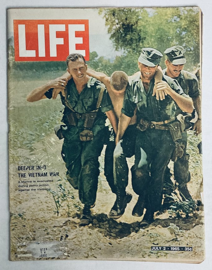 Cover of VTG Life Magazine July 2, 1965 titled 'A Marine is Evacuated in Vietnam War' featuring soldiers aiding a wounded comrade.