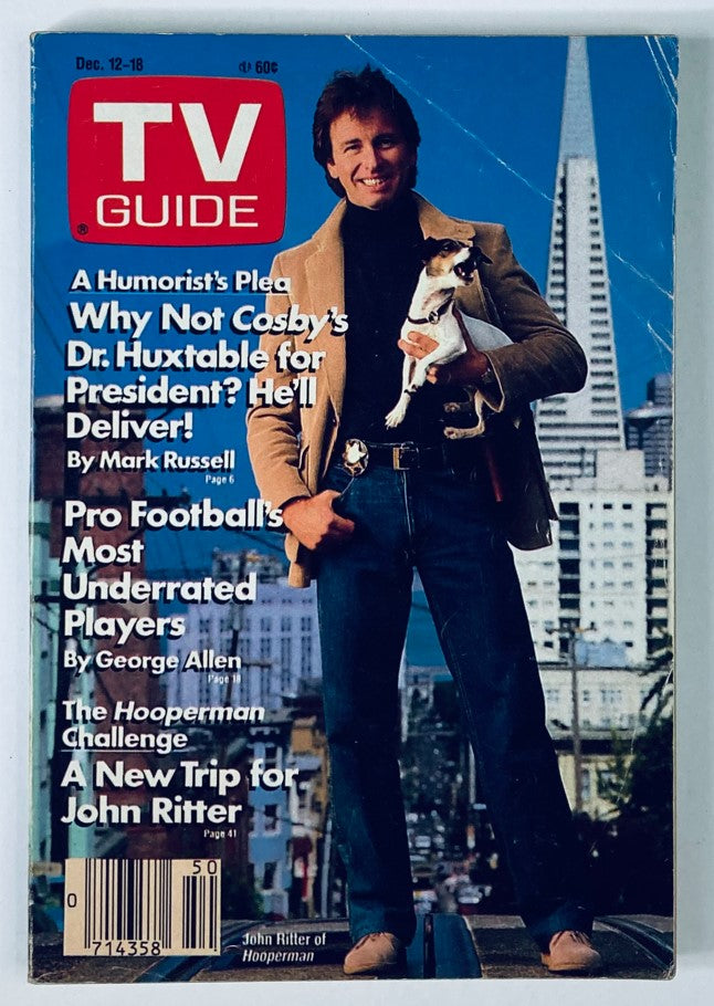 TV Guide Magazine cover from December 12, 1987 featuring John Ritter with a dog, highlighting articles including 'A New Trip for John Ritter' and showcasing a colorful city backdrop.